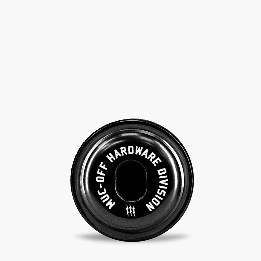 Muc-Off Precision Tubeless Capsule for tubeless tire repair in pink, featuring compact design and repair tools.