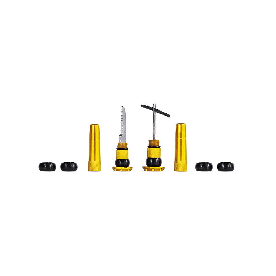 Pair of black Muc-Off Stealth Tubeless Plugs for tubeless tire repair, shown on a white background.