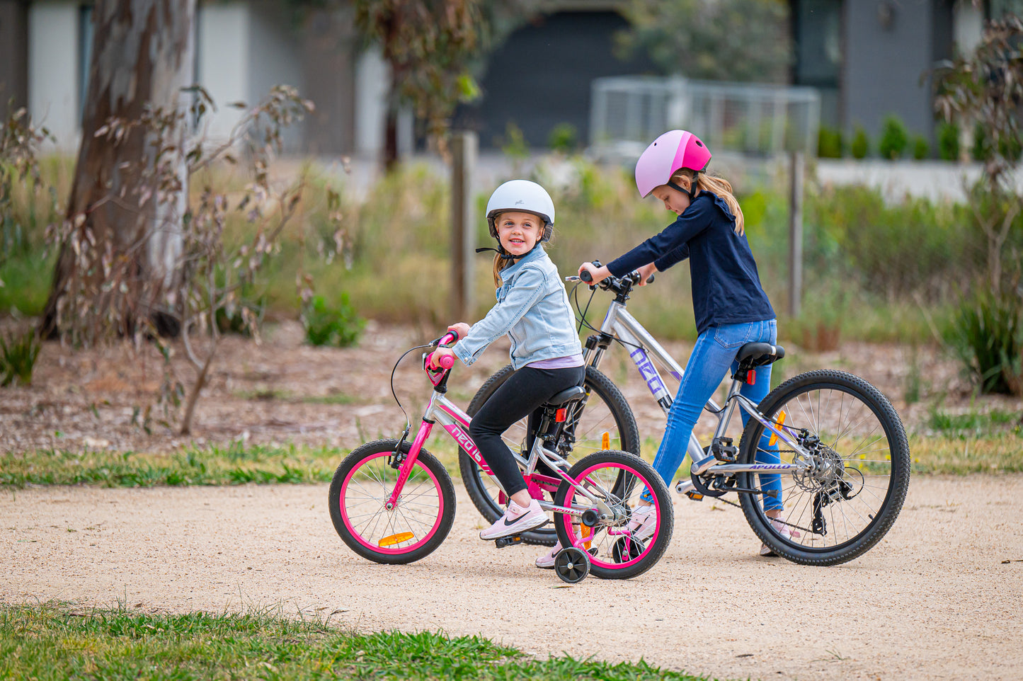 Neo+ 16-inch girl's kids bike by Neo featuring a colorful frame and training wheels for young cyclists.
