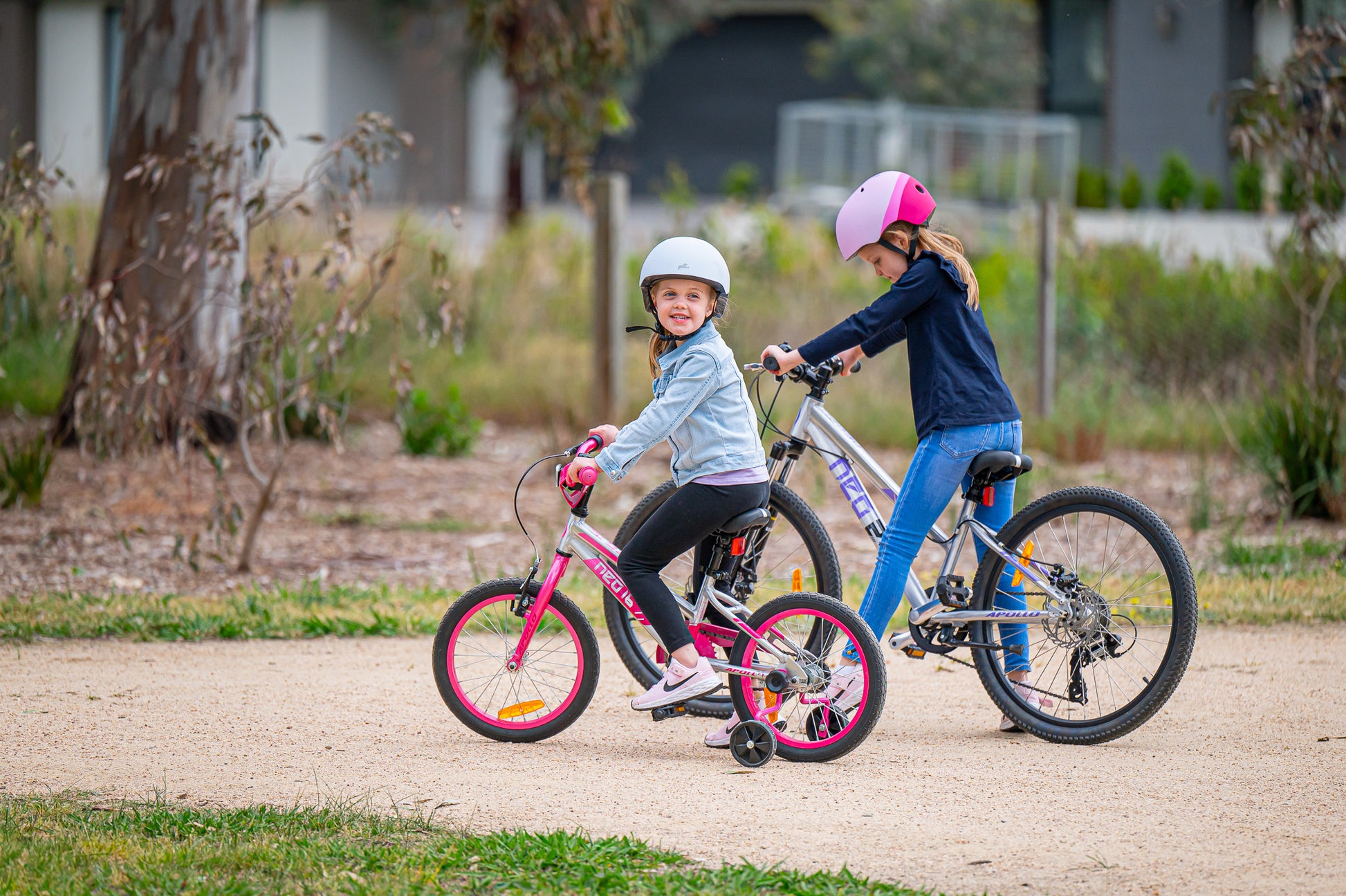 Neo+ 16-inch girl's kids bike by Neo featuring a colorful frame and training wheels for young cyclists.
