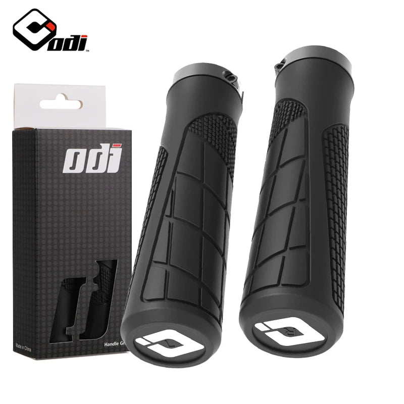 Black ODI clamp-on rubber grips for bicycles, featuring textured surface for improved grip and comfort.