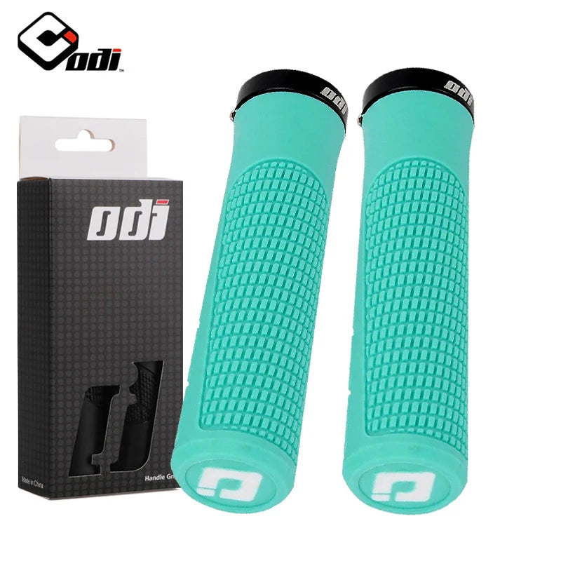 Black ODI clamp-on rubber grips for bicycles, featuring textured surface for secure hand grip and comfort.