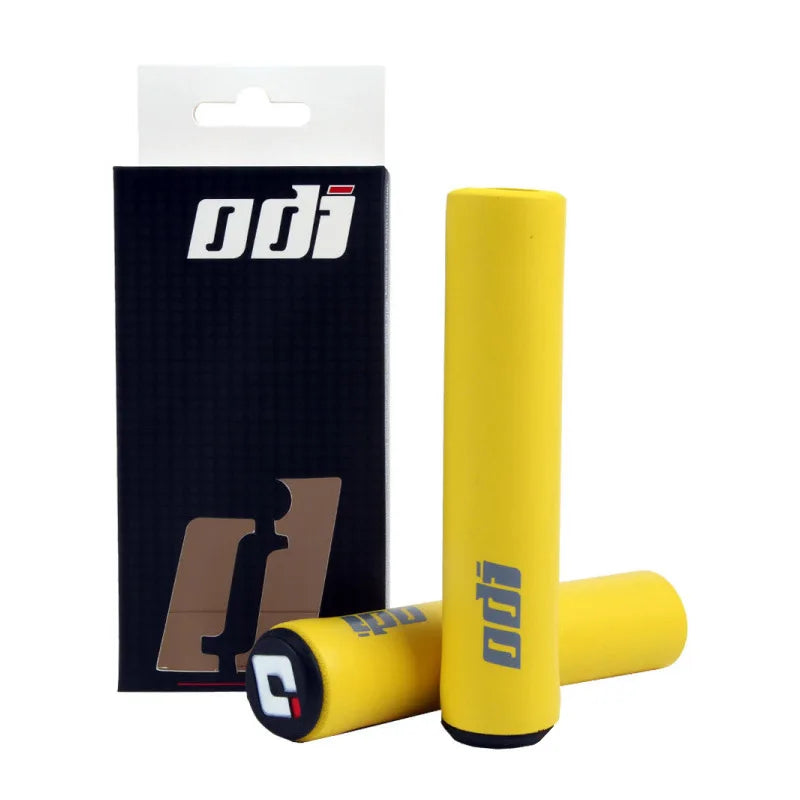 Black ODI silicone grips for bicycles, shown with textured surface and ergonomic design for comfortable handling.