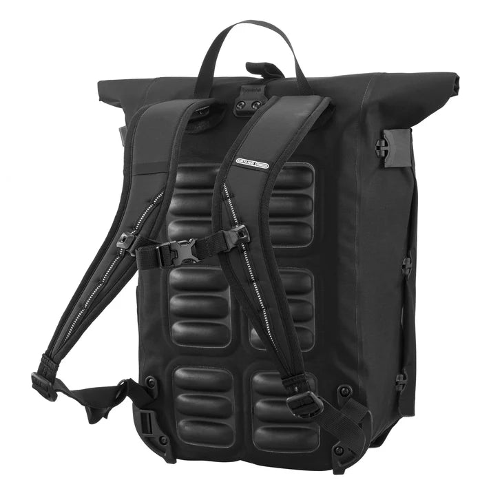 Ortlieb Urban Vario PS QL3.1 26L panniers mounted on bicycle, showcasing durable waterproof design and adjustable mounting system.