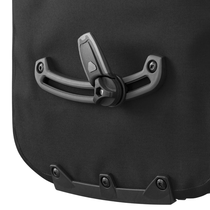 Ortlieb Urban Vario PS QL3.1 26L panniers mounted on a bike, showcasing durable waterproof storage for urban commuting.
