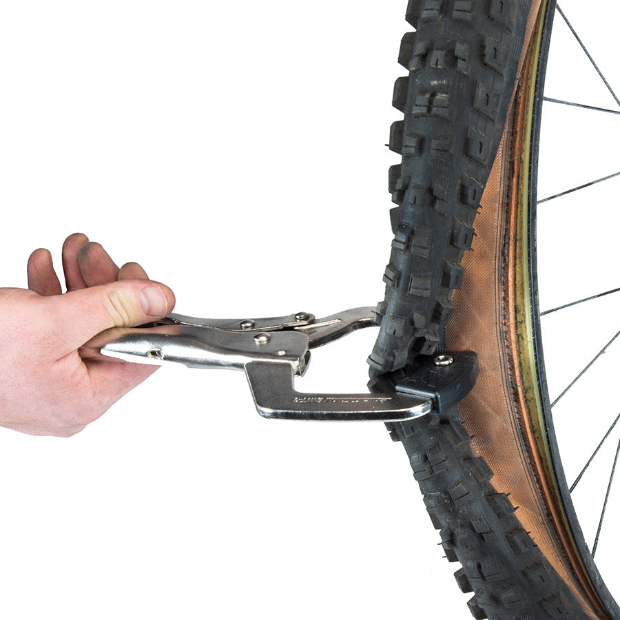 Park Tool BMT-1 tube and tire repair kit with tire bead breaker tool for bicycle tire repairs and rim separation.