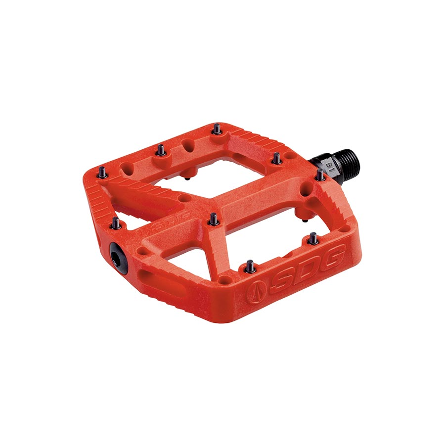 Pair of black SDG Components platform pedals with textured surfaces for enhanced grip and durability.