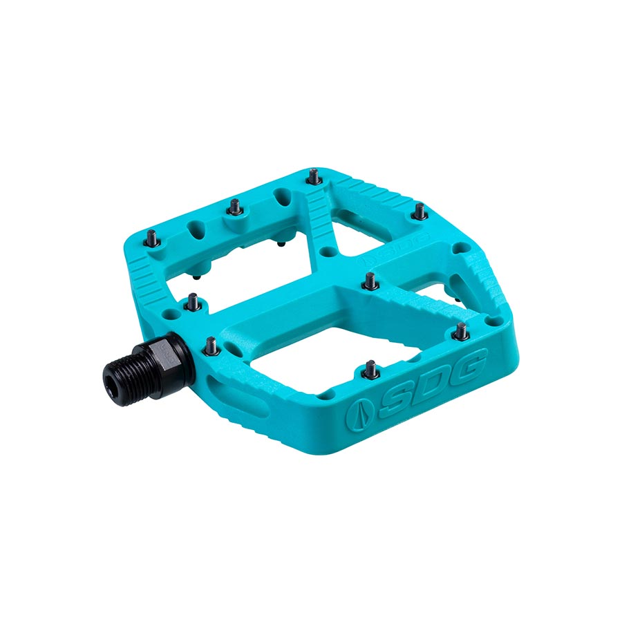 Pair of SDG Components Comp Pedal platform pedals in black, featuring durable design and textured grip for cycling.