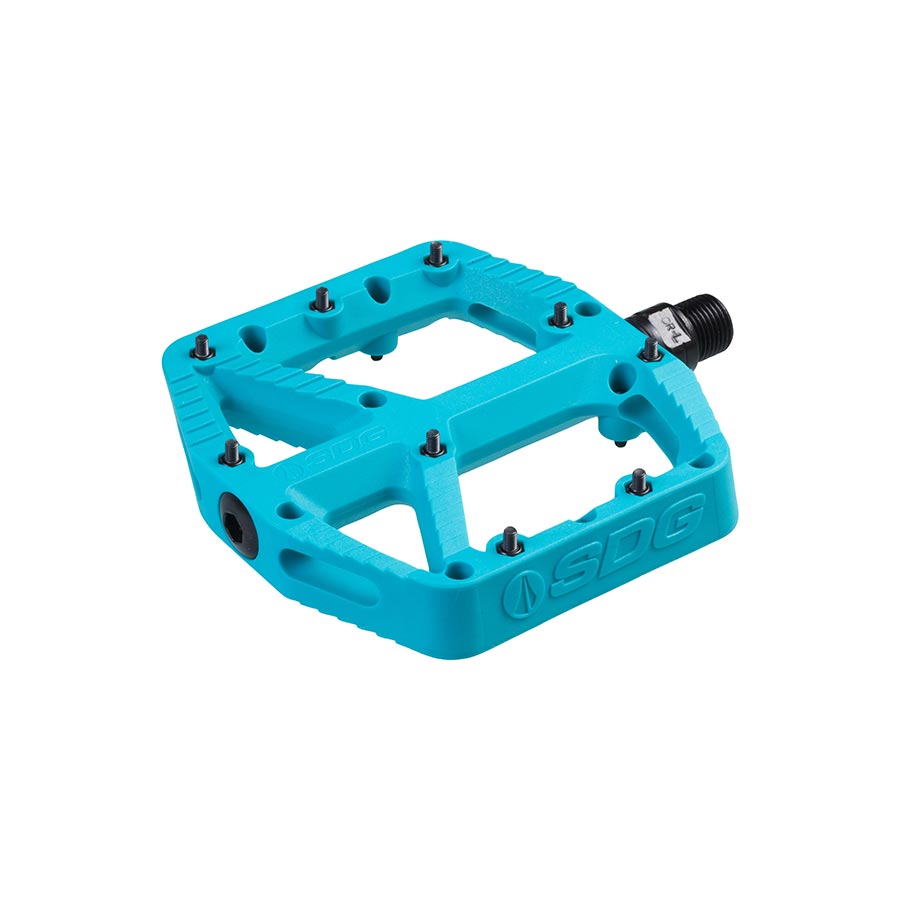 Pair of black SDG Components platform pedals for bikes, showing close-up of textured pedal surfaces and durable pedal bodies.