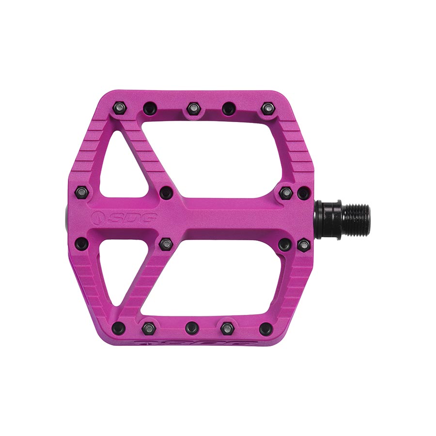 Pair of SDG Components black platform pedals with durable metal bodies and textured surfaces for secure bike pedal grip.