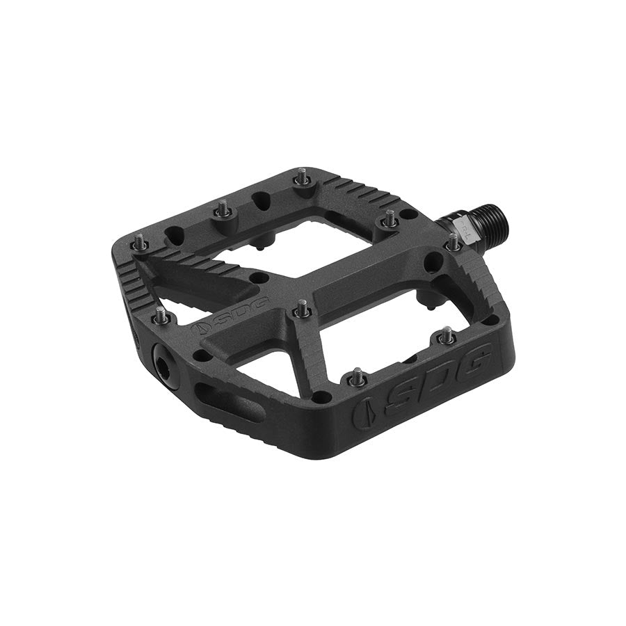 Pair of SDG Components black platform pedals for bikes, featuring durable design and wide foot support.