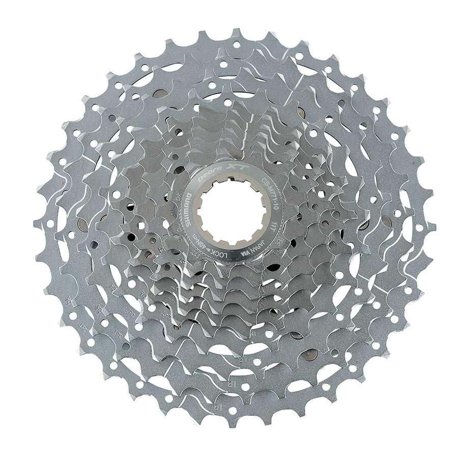 Shimano XT CS-M771-10 11-32t cassette with 11 to 32 teeth, featuring multiple sprockets for mountain bike gearing.