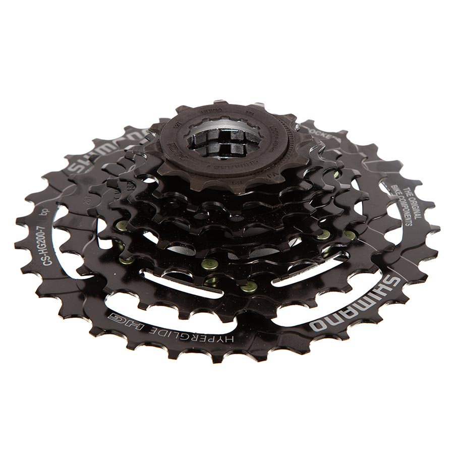 Shimano CS-HG200-7 cassette with 12-28 tooth gear set, black metal cogs for mountain or road bike gearing