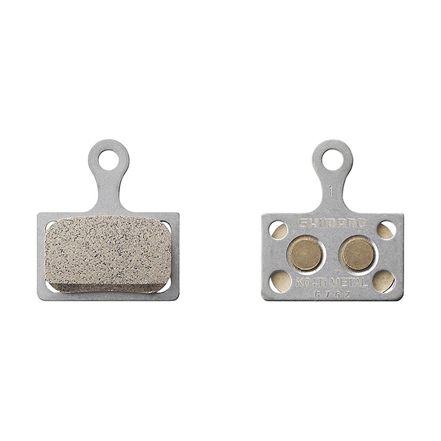 Shimano K-Type metallic disc brake pads pair, showing the durable brake pads with metallic finish for bicycle disc brakes.