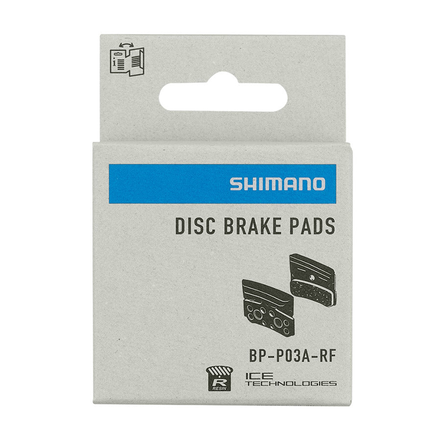 Shimano P-Type disc brake pads made of resin, designed for bicycle braking systems, shown in the image.
