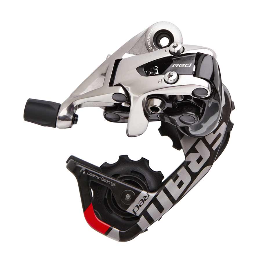 Red SRAM 2012 rear derailleur for road bikes with short cage, showcasing precise component design and vibrant color.