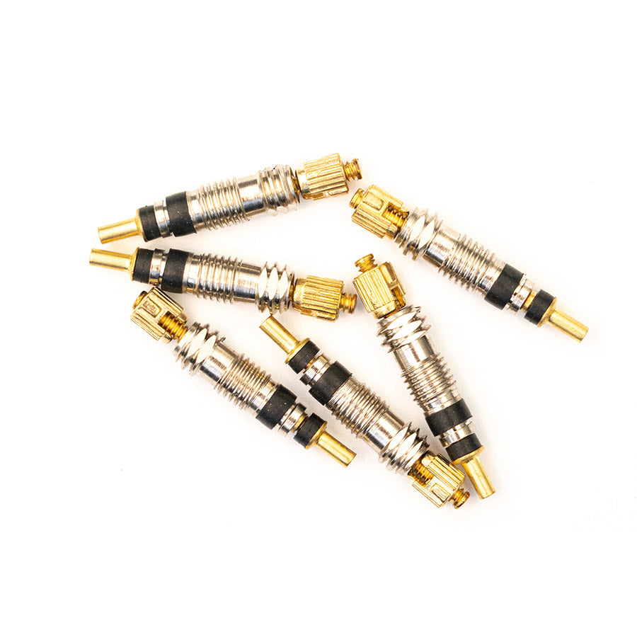 Stans No Tubes tubeless valve core for bike tires, replacement part with metal valve stem and core in close-up shot