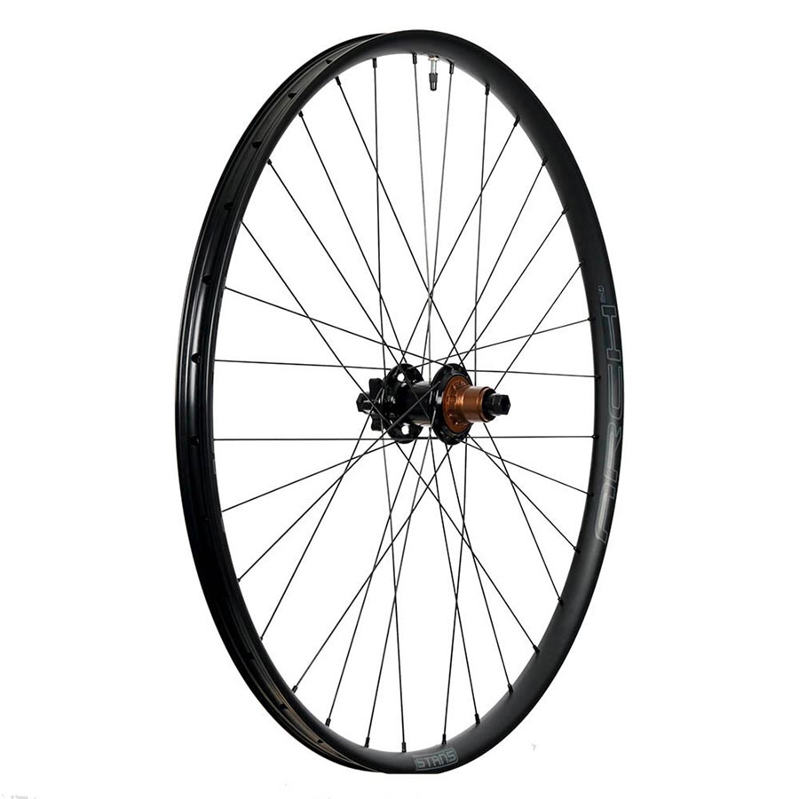 Stans No Tubes Arch MK4 27.5-inch mountain bike wheel, front view with 32 spokes, 15mm thru-axle, 110mm boost spacing, 6-bolt disc.