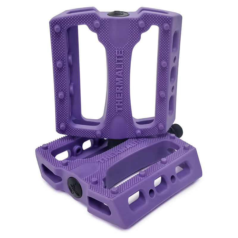 STLNbikes Thermalite platform pedals with colorful tie-dye design, durable metal body, and non-slip pins for bike cycling.