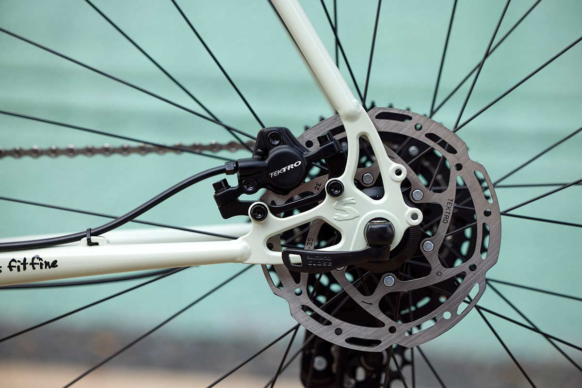 Surly Preamble 700c gravel and commuter bike in hi-viz black, featuring a lightweight frame and off-road tire setup.