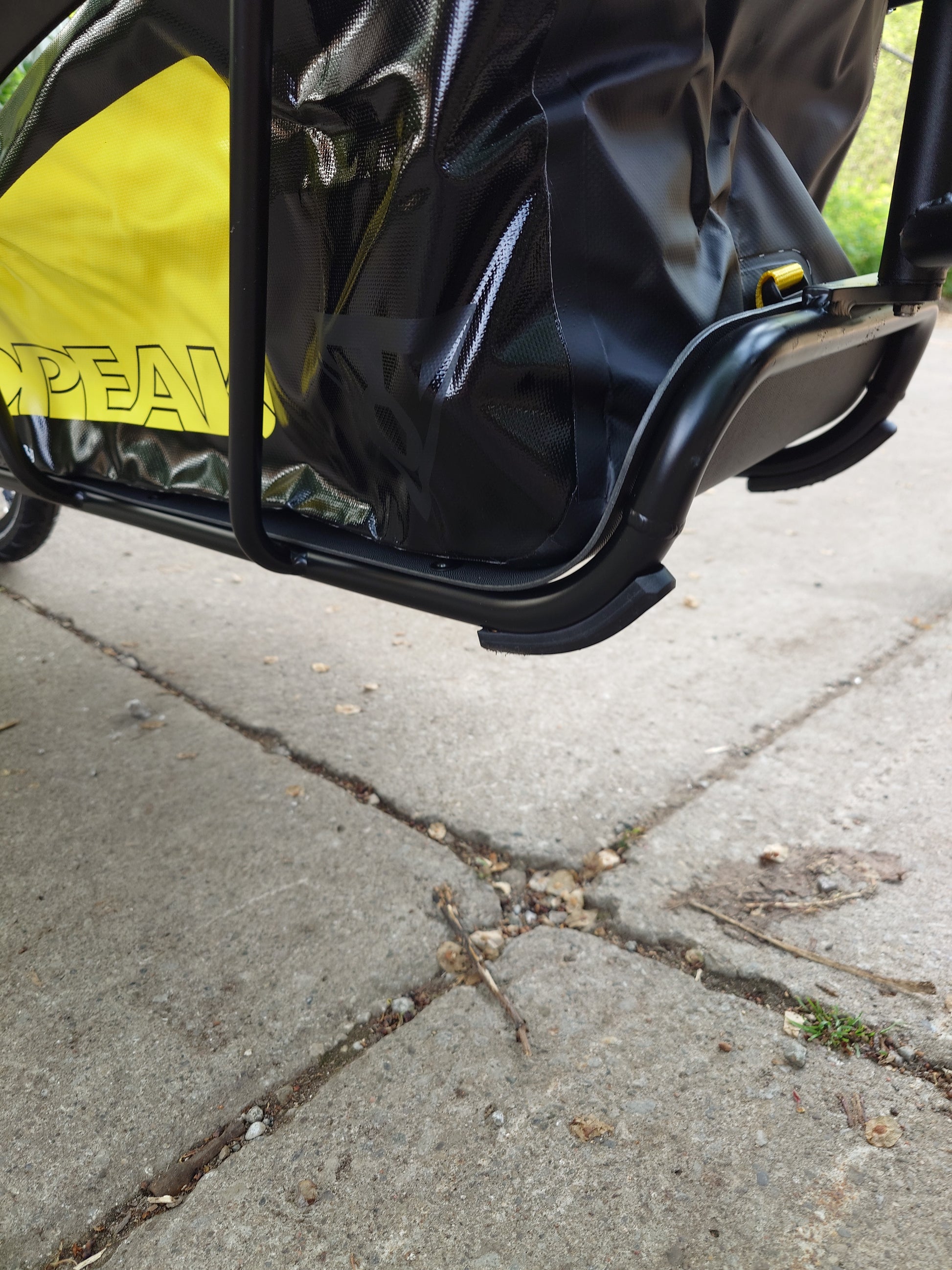 Topeak Journey TX Thru-Axle Trailer attached to a bicycle, ready for hauling gear on a cycling trip.