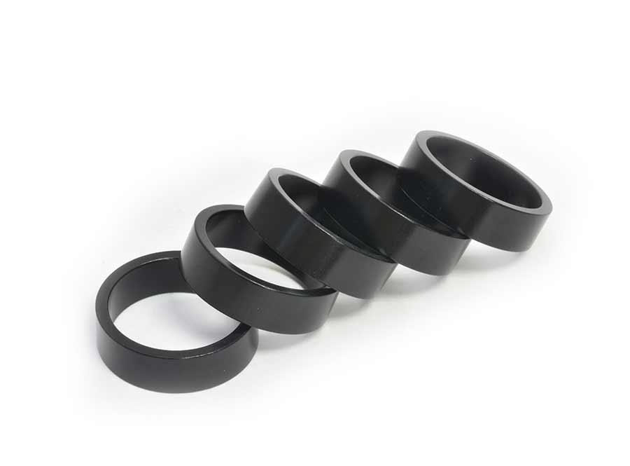 Wheels Manufacturing aluminum headset spacers in various sizes including 1.5mm, 2.5mm, 5mm, 7.5mm, and 10mm, 105-piece set