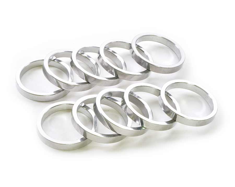 Wheels Manufacturing aluminum headset spacers in various sizes including 1.5mm, 5mm, 7.5mm, and 10mm, 105-piece set.