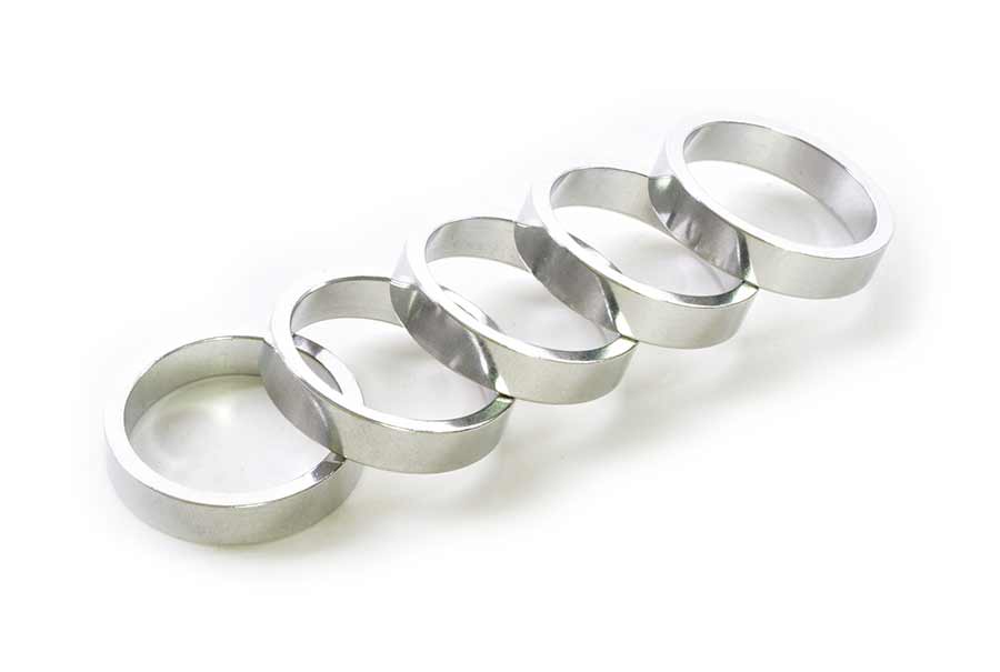 Wheels Manufacturing aluminum headset spacers in various sizes, 1.5mm to 10mm, for bike headset assembly and customization.