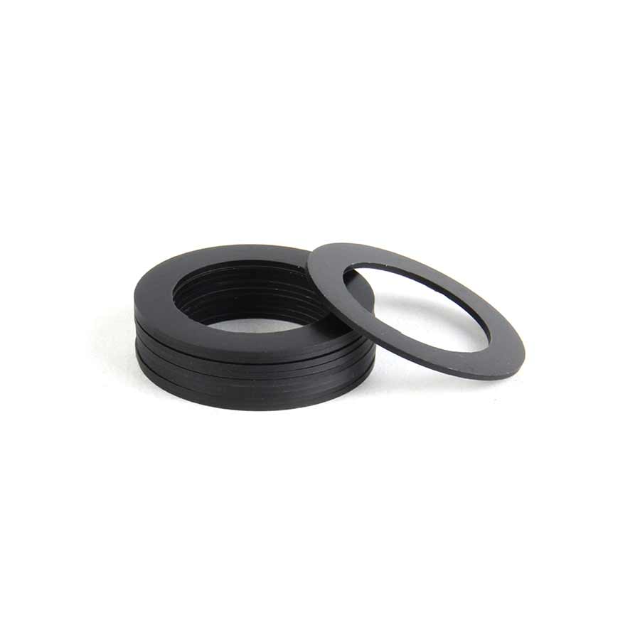 Set of ten Wheels Manufacturing 24mm spindle bottom bracket spacers, 0.5mm thick for precise bike spindle fitting.