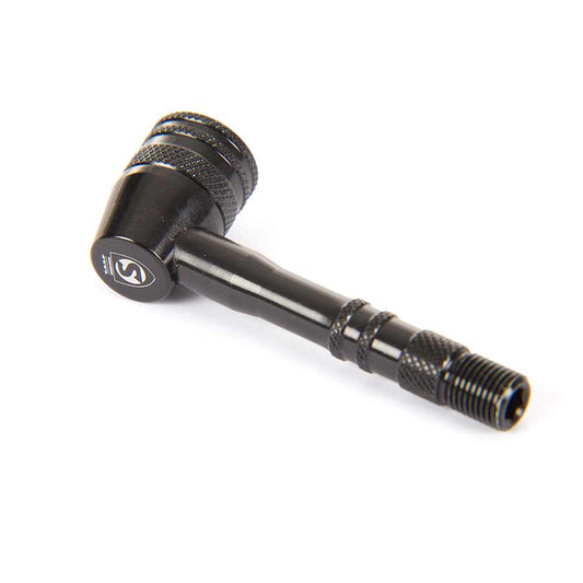 Zipp disc wheel valve adaptor for tube accessories, showing the black valve adapter attached to a bicycle disc wheel.